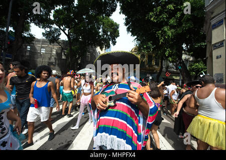South America, Brazil - February 10, 2018: Disguised reveler smiles for the camera at a carnival street party in downtown Rio de Janeiro Stock Photo
