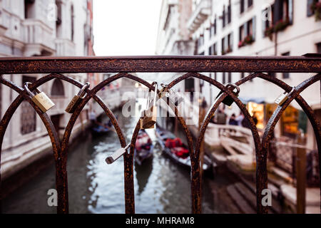 Lovers padlocks on a bridge in Venice, Italy Stock Photo