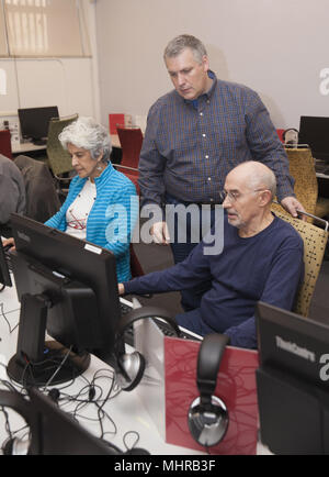 Seniors at a senior citizen center take a computer  class in lower Manhattan, New York City. Stock Photo