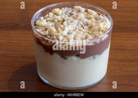 Sweet spoon with lemon and chocolate cream, dessert in transparent glass. Food photography Stock Photo