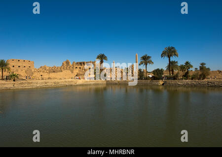 View across the Sacred Lake, Karnak Temple Complex, UNESCO World Heritage Site, Luxor, Egypt Stock Photo