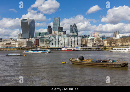 A London cityscape of the River Thames featuring the Gherkin, Cheesegrater and Walkie-talkie skyscrapers amongst the London city skyline. Stock Photo