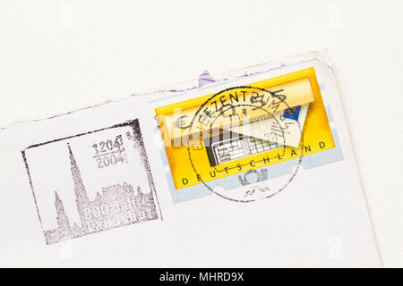 Envelope dated from 2004 with Landshut, Germany Postage stamp on white paper, white background. Stock Photo