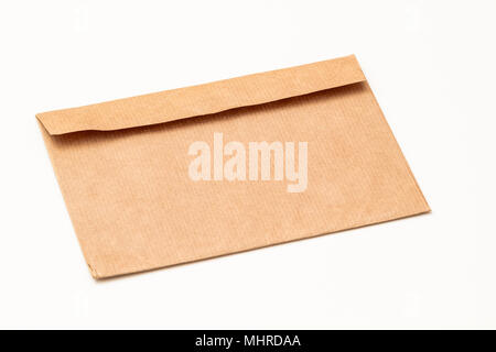Brown craft paper envelope isolated on white background. Horizontal view. Stock Photo