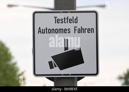 02 May 2018, Germany, Karlsruhe: A sign reading 'Test area for autonomous driving' at the Ostring. The test area will officially be opened on 03 May in Karlsruhe. Photo: Uli Deck/dpa Stock Photo