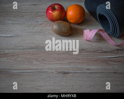 Health and fitness concept flatlay with exercise equipment on modern  colorful background with copy space. Stock Photo