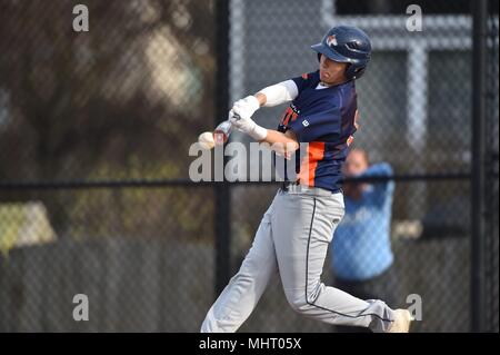 Batter making contact with the baseball during a high school baseball game. USA. Stock Photo