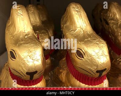 Gold foil wrapped chocolate bunnies, closeup Stock Photo