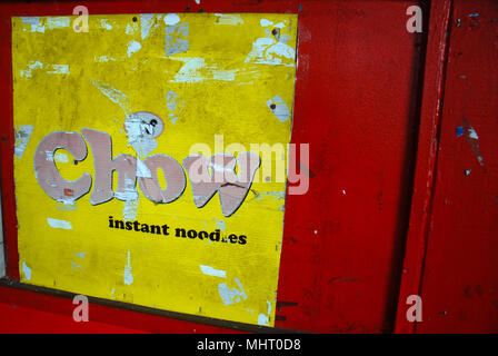 Chow Instant Noodle advert on red door, Suva, Fiji. Stock Photo