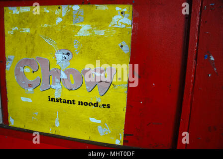 Chow Instant Noodle advert on red door, Suva, Fiji. Stock Photo