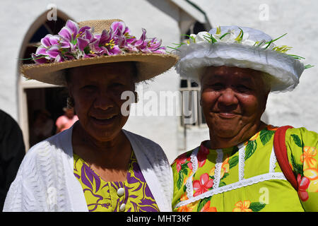 AITUTAKI, COOK ISLAND - AUGUST, 27 2017 - Local people at the christian mass wearing traditional colorful polynesian dress Stock Photo