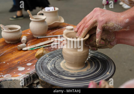 clay pitcher on a potter's wheel Stock Photo