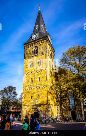 A historical brick church with a bell and clock tower built according to European architecture in Enschede, Netherlands Stock Photo