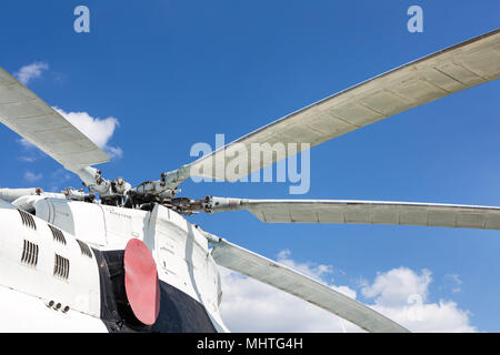 Close-up  blade rotors of big cargo-passenger helicopter against blue sky on background Stock Photo