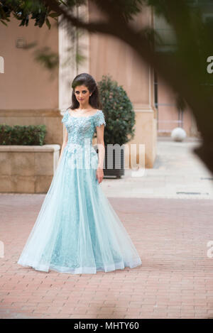 Full length portrait of a beautiful woman standing outdoors Stock Photo