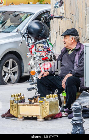 istanbul, Turkey-11th October 2011: Shoe shine man waiting for business. There are many shoe shiners in the city. Stock Photo