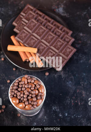 Chocolate tablet next to other candies Stock Photo