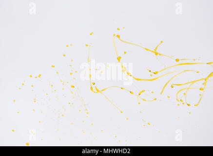 Oil splashing. Orange water splash isolated on white background. Stock Photo