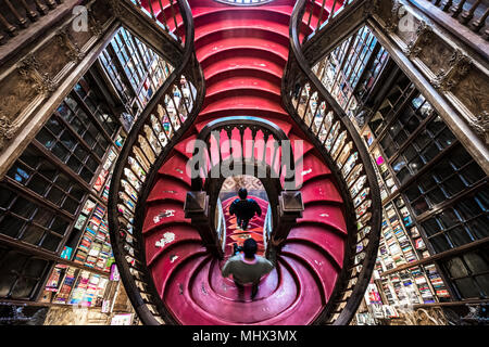 Curved wooden staircase in library, Livraria Lello & Irmão bookstore, Porto, Portugal, Europe Stock Photo
