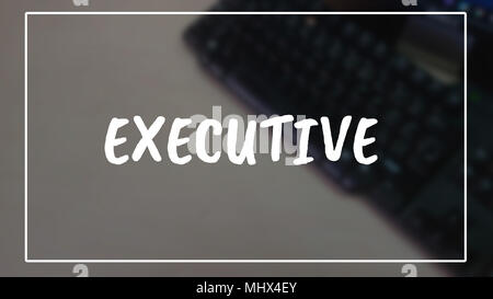 Executive word with business blurring background Stock Photo