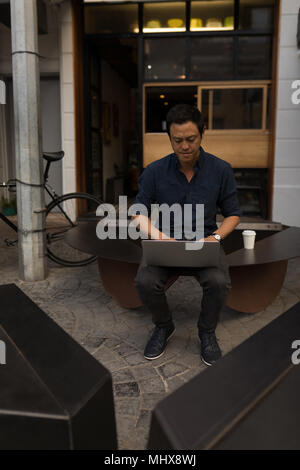 Businessman using laptop in the coffee shop Stock Photo