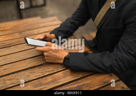 Businessman using mobile phone in the cafe Stock Photo