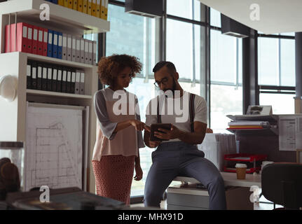 Architects discussing over digital tablet Stock Photo