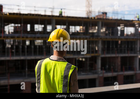 Female architect standing at construction site Stock Photo