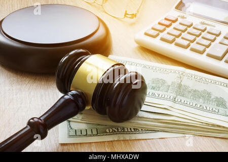 Financial fraud. White collar crime. Gavel, calculator and money. Stock Photo