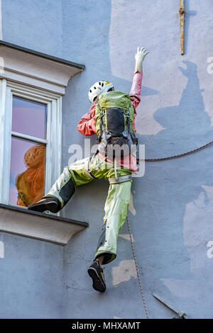 climber puppet on a building Stock Photo