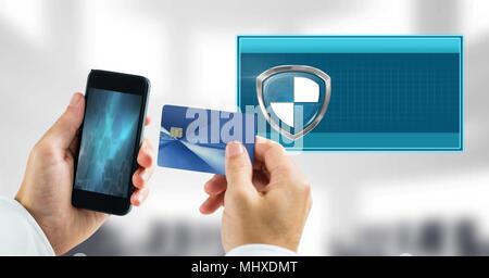 Secure transaction shield icon and phone with bank card Stock Photo