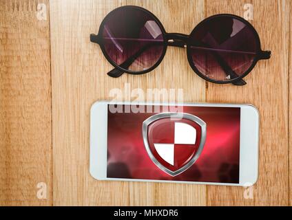 Antivirus security protection shield on phone with sunglasses Stock Photo