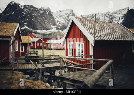 Tipical red fishing houses in a Harbor on Lofoten islands, Norway Stock Photo