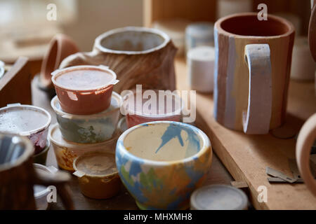 Paint Brushes With Gouache In Cup Isolated On White Stock Photo