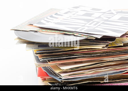 A stack of seven inch 45rpm vinyl singles mostly with songs from the 1980s that have been stored in a loft from a record collection. Dorset England UK Stock Photo