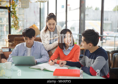 Young men and women in the coffee shop Stock Photo