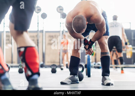 Small group of people training in gym Stock Photo