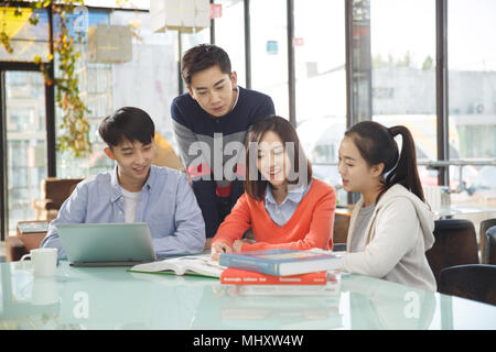 Young men and women in the coffee shop Stock Photo