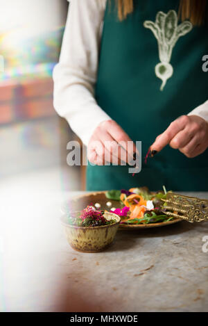 Woman preparing vegan dish Stock Photo