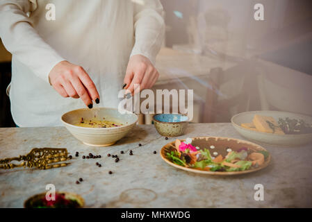 Woman preparing vegan dish Stock Photo