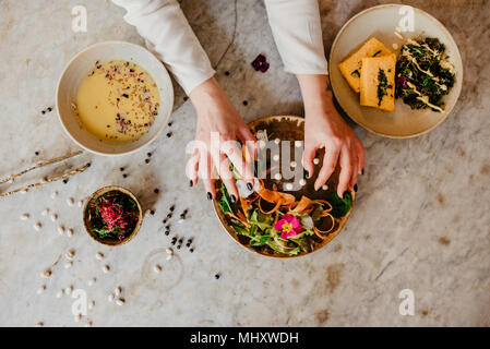 Woman preparing vegan dish Stock Photo