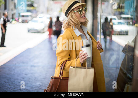 Woman window shopping, Cape Town, South Africa Stock Photo