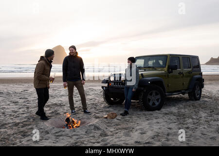 Friends on beach, Pacific City, Oregon, United States Stock Photo