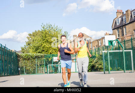 Two mature men, outdoors, jogging Stock Photo