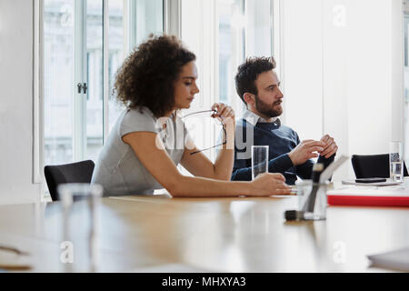 Colleagues in meeting in boardroom Stock Photo