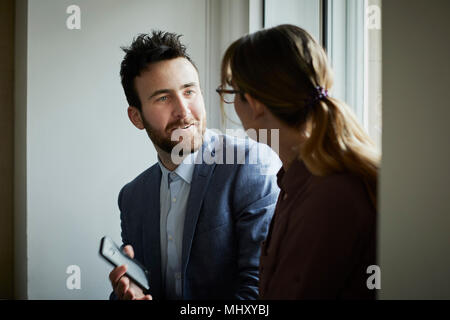 Colleagues talking Stock Photo