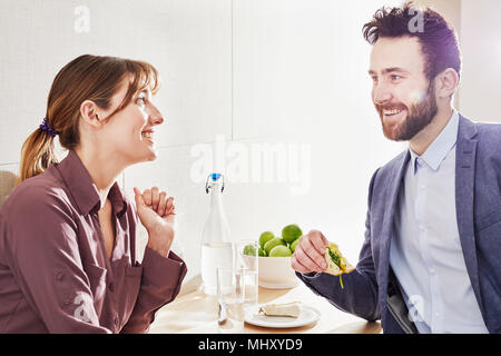 Colleagues having lunch smiling Stock Photo