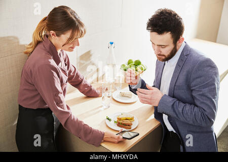 Colleagues having lunch Stock Photo