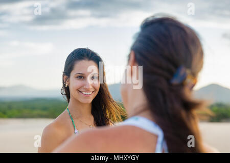 Portrait of woman looking at mother smiling, Caucaia, Ceara, Brazil Stock Photo