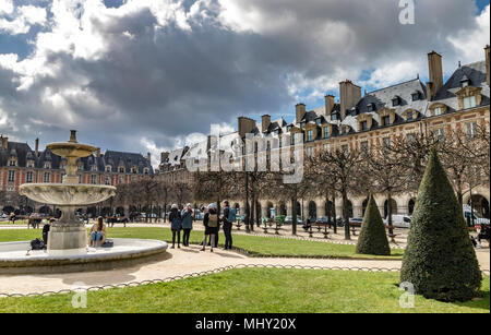 Elegant rooftops and windows adorn the buildings at Place des Vosges in The Marais district of Paris,one of the most beautiful squares in Paris Stock Photo